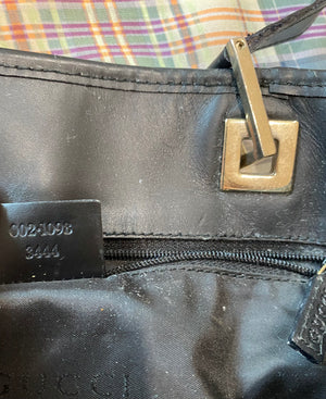 Sold at Auction: Gucci Black Canvas Monogram Toiletry Bag